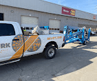Everwork truck towing equipment trailer at a commercial building